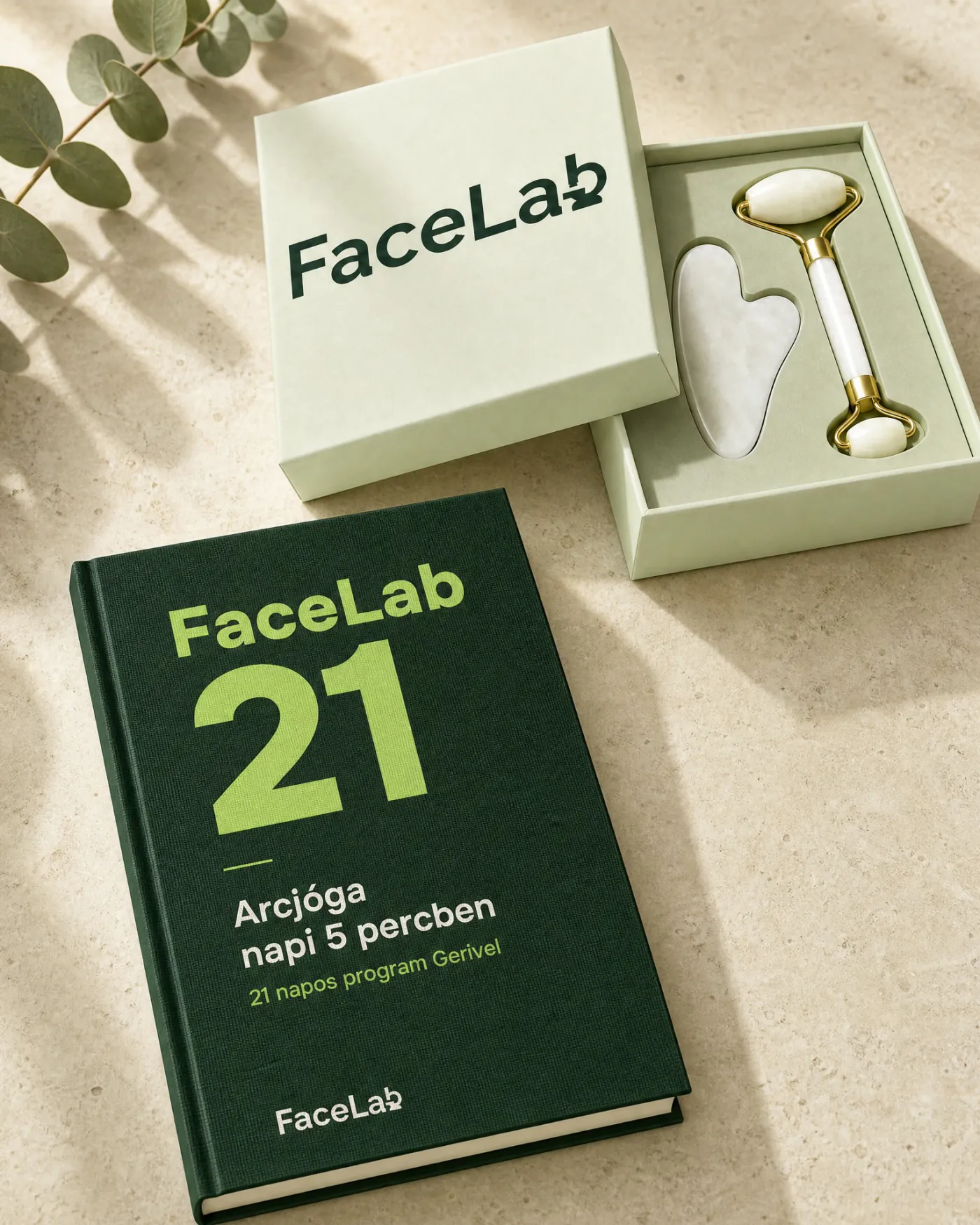 A FaceLab 21 könyv, mellette a gua sha kő és az arcroller a díszdobozban